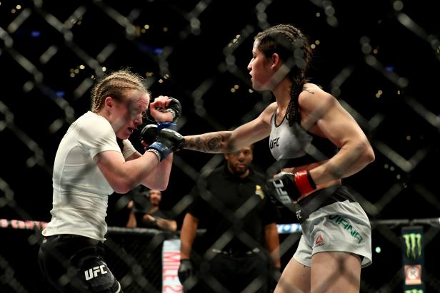 Polyana Viana throws a punch at JJ Aldrich in the second round of the women's straw weight bout during UFC 227 at Staples Center on August 4, 2018, in Los Angeles, United States [Joe Scarnici/Getty Images]