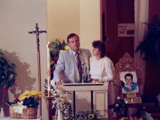 James Kilroy and his wife Helen address the congregation at Our Lady of Lourdes Catholic Church in Hitchcock, Texas, during their son's funeral, April 15, 1989. Their son, Mark, is pictured on the right. He was abducted and killed during spring break in Mexico. (AP Photo/Pam McDonald)