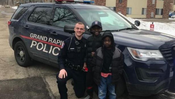 Officer Lynema, Thomas Daniel, and Thomas’s brother [Grand Rapids Police Department]