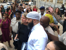 Adnan Syed, center, leaves the Cummings Courthouse in Baltimore. A judge has ordered the release of Syed after overturning his conviction for a 1999 murder that was chronicled in the hit podcast “Serial.”