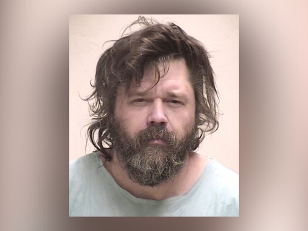 Timothy Haslett, Jr., pictured here in a mug shot, is accused of kidnapping, raping, and beating a woman. 