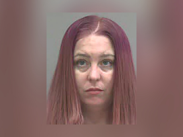 Kristi Nicole Gilley, pictured here with pink hair, was arrested on a warrant for kidnapping out of Clay County, Missouri.