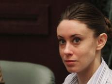 Casey Anthony sits at the defense table as her attorney Jose Baez enters before the start of her murder trial at the Orange County Courthouse in Orlando, Florida, Friday, June 24, 2011. (Red Huber/Orlando Sentinel/MCT)