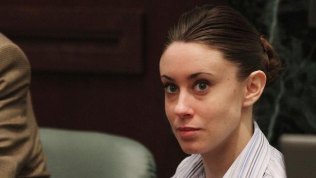 Casey Anthony sits at the defense table as her attorney Jose Baez enters before the start of her murder trial at the Orange County Courthouse in Orlando, Florida, Friday, June 24, 2011. (Red Huber/Orlando Sentinel/MCT)