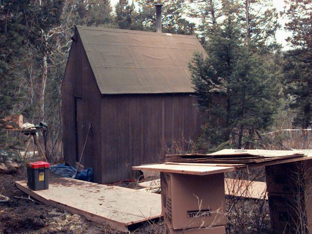 FILE--Materials used by the FBI in its search of Theordore Kaczynski's mountain cabin in Lincoln, Mont., sit outside the cabin's door in this April 1996 file photo.  U.S. District Judge Garland Burrell Jr. denied a defense motion to suppress virtually all of the evidence seized from the remote cabin, Friday, June 27, 1997.  The evidence in question _ including a journal in which Kaczynski allegedly admits responsibility for the Unabomber attacks and an unexploded bomb _ is at the heart of the government's case. (AP Photo/Elaine Thompson)
