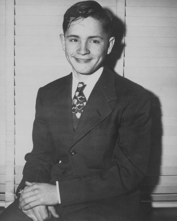 Three days before he ran away from Boy's Town, Charles Manson poses in a suit and tie.