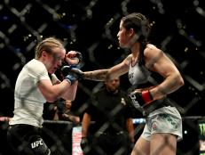 LOS ANGELES, CA - AUGUST 04: Polyana Viana throws a punch at JJ Aldrich in the second round of the women's straw weight bout during UFC 227 at Staples Center on August 4, 2018 in Los Angeles, United States. (Photo by Joe Scarnici/Getty Images)