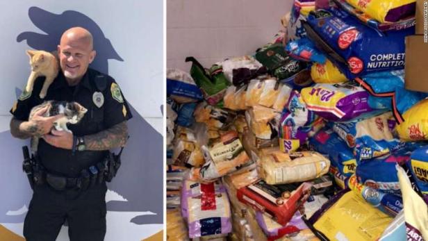 Muncie Police Officer with cats and donated supplies [Muncie Police Department]