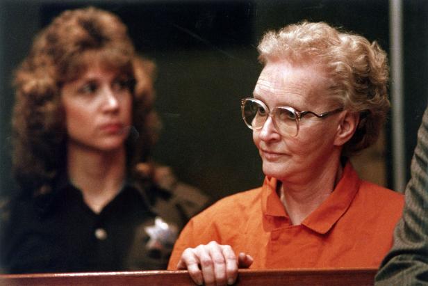 In this November 17, 1988 file photograph, boarding House murder suspect Dorothea Montalvo Puente appears for arraignment in Sacramento, California Municipal Court. Sheriff Deputy Lori Aquitania stands on the left.  (Photo by Owen Brewer/Sacramento Bee/Tribune News Service via Getty Images)