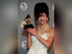 Selena receives a Grammy Award at The 36th Annual Grammy Awards in March 1994 [via Getty Images]