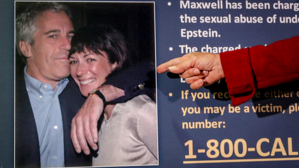In this July 2, 2020, file photo, Audrey Strauss, acting U.S. attorney for the Southern District of New York, points to a photo of Jeffrey Epstein and Ghislaine Maxwell during a news conference in New York. Maxwell, Epstein's former girlfriend, claims a guard physically abused her at the federal prison in Brooklyn where she's being held. Maxwell's lawyer told a judge in a letter Tuesday, Feb. 16, 2021, that British socialite who has pleaded not guilty to recruiting girls for Epstein to sexually abuse in the 1990s, is losing weight, hair and her ability to concentrate and prepare for trial. 