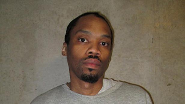 This undated file photo released by Oklahoma Department of Corrections shows Julius Jones. Oklahoma County's top prosecutor is asking the state's Pardon and Parole Board to reject a commutation request from Jones. Jones' case has drawn national attention and he's scheduled for a commutation hearing next week. Jones was convicted and sentenced to die for the 1999 shooting death of Edmond businessman Paul Howell.
