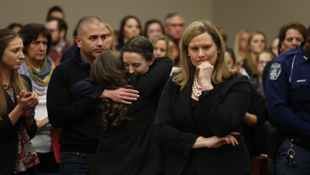 Michigan Assistant Attorney General Angela Povilaitis (R) stands as former Michigan State University and USA Gymnastics doctor Larry Nassar listens during impact statements during the sentencing phase in Ingham County Circuit Court on January 24, 2018 in Lansing, Michigan. More than 100 women and girls accuse Nassar of a pattern of serial abuse dating back two decades, including the Olympic gold-medal winners Simone Biles, Aly Raisman, Gabby Douglas and McKayla Maroney -- who have lashed out at top sporting officials for failing to stop him. 