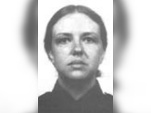 Patrolwoman Debra Sue Corr headshot in uniform black and white image