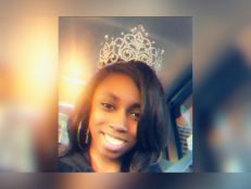 Lejourney Farrow wearing a pageant crown sitting in car smiling daytime with a seatbelt on