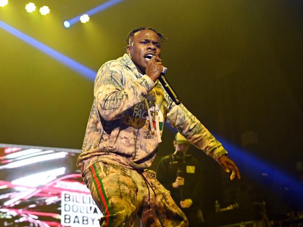 Rapper DaBaby, wearing a Gucci track suit, performs onstage during "Rolling Loud Presents: DaBaby Live Show Killa" tour at Coca-Cola Roxy on December 04, 2021 in Atlanta, Georgia. On April 13, 2022, an intruder was shot at the performer's home.