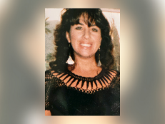 Cheryl “Cheri” Huss, pictured here smiling in a black shirt and dangly earrings, had been stabbed multiple times and bitten by her killer, who wasn't identified until 2022.