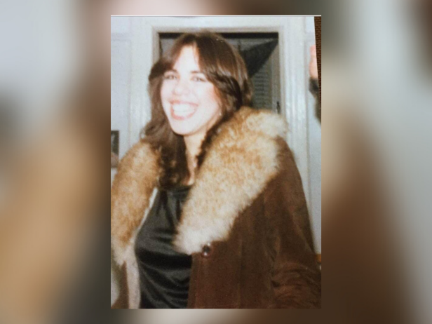 Eve Wilkowitz, shown here smiling with brown hair and wearing a fur coat, was murdered in 1980.