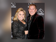 Julie Chrisley [left] and Todd Chrisley [right] attend the grand opening of E3 Chophouse Nashville on November 20, 2019 in Nashville, Tennessee. 