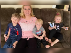 Bryant Karels, 5, Gideon Karels, 2, and Cassidy Karens, 3, pictured here on the couch smiling with their mother, Debbie. 