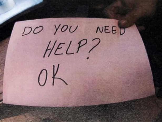 A homemade sign written by a restaurant manager, asking "Do you need help?" at the top and "Ok" at the bottom. 