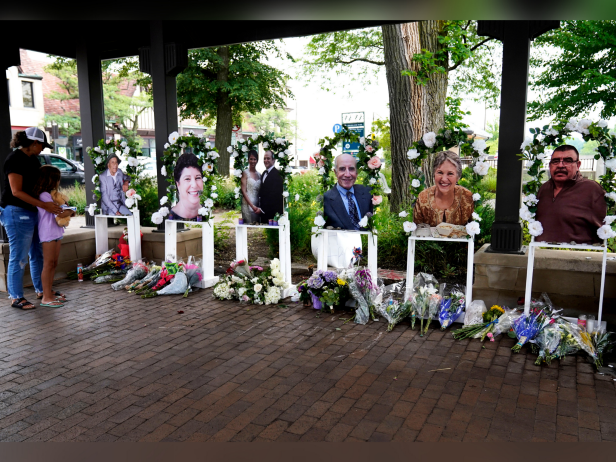 Visitors pay their respects at altars for the seven people killed in Monday's Fourth of July mass shooting, Thursday, July 7, 2022, in Highland Park, Illinois.