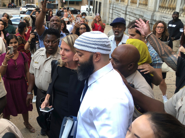 Adnan Syed, center, leaves the Cummings Courthouse in Baltimore. A judge has ordered the release of Syed after overturning his conviction for a 1999 murder that was chronicled in the hit podcast “Serial.”