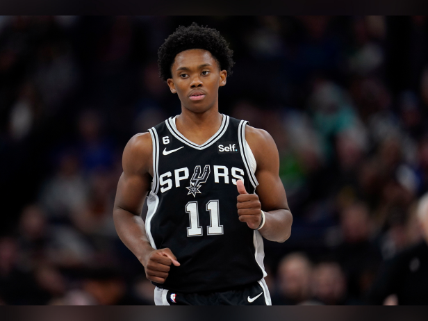 San Antonio Spurs guard Joshua Primo (11) looks down the court during the second half of an NBA basketball game against the Minnesota Timberwolves, Monday, Oct. 24, 2022, in Minneapolis.