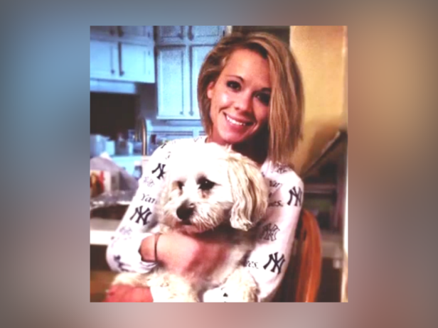 Kira Steger, pictured here smiling with her dog, was murdered by her husband in February 2013.