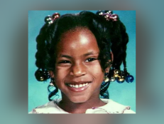 Alexis Patterson, pictured here, is a Black female with black hair and brown eyes. Alexis has a scar below her right eye. She has a bump on her left pinky finger.