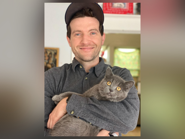 Colin M. Smith, pictured here smiling and holding a cat, was fatally stabbed on July 2, 2023 in Portland, Oregon.